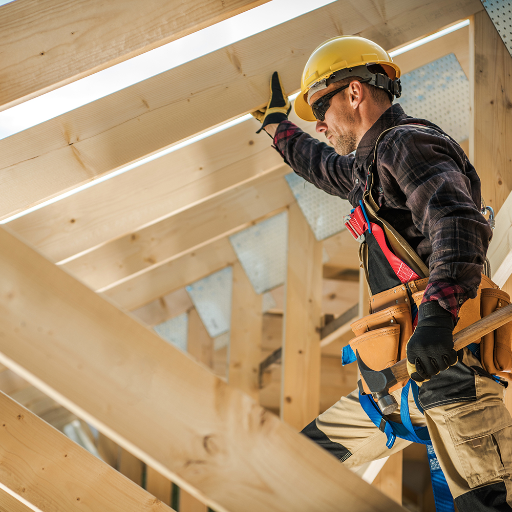 Construction,Worker,On,Duty.,Caucasian,Contractor,And,The,Wooden,House