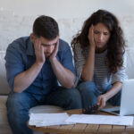 Concerned,Upset,Millennial,Couple,Counting,Overspent,Budget,,Doing,Paperwork,,Thinking