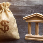 A,Bag,With,Dollar,Money,And,A,Bank,Or,Government