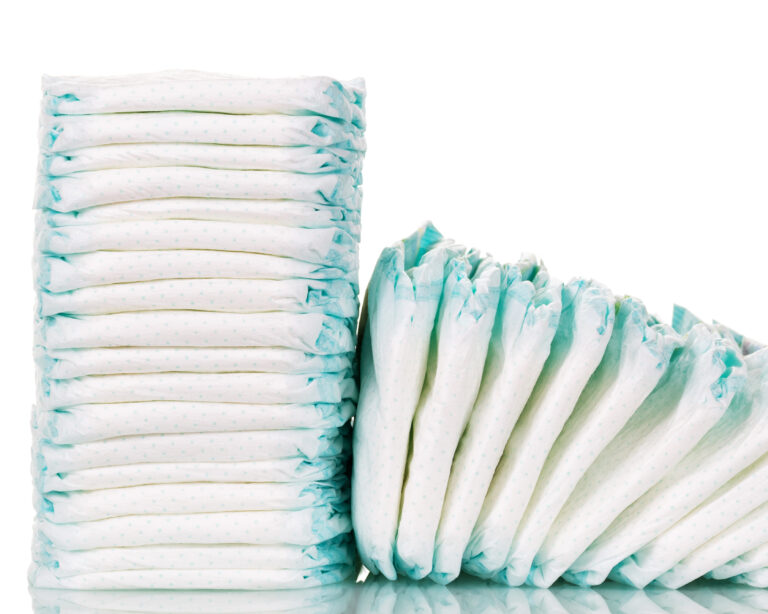 Stacks diapers for children isolated on white background